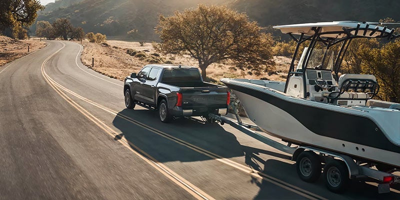 A 2022 Toyota Tundra tows a boat