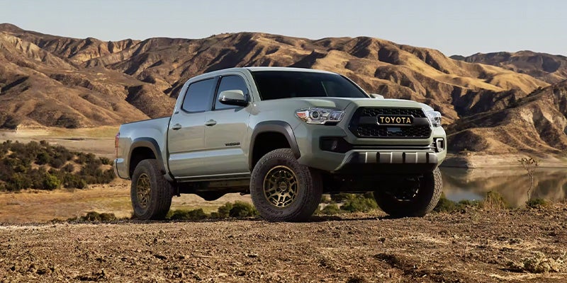Grey 2023 Toyota Tacoma parked in a desert