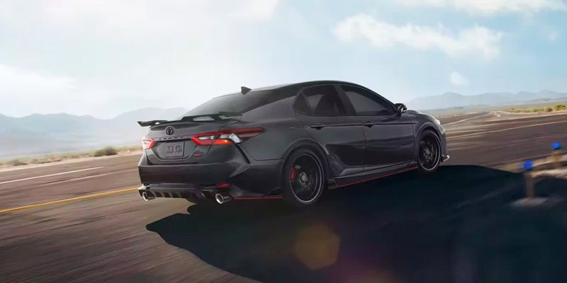 A 2024 Toyota Camry driving down a road near Kent, OH