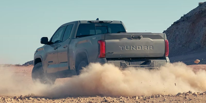 A tough 2024 Tundra kicking up dust as it off-roads in Kent, OH