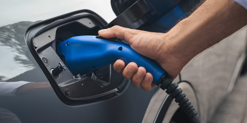 A 2025 Toyota Prius Plug-in Hybrid that is being actively charged in Kent, OH