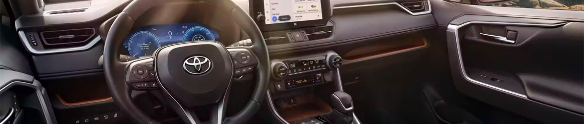 The dashboard and infotainment system of a 2024 Toyota RAV4 in Kent, OH