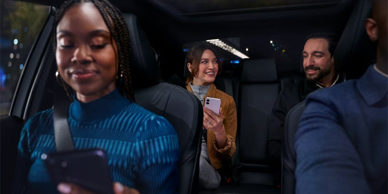 A family using the connectivity features in the 2025 Toyota Camry in Kent, OH